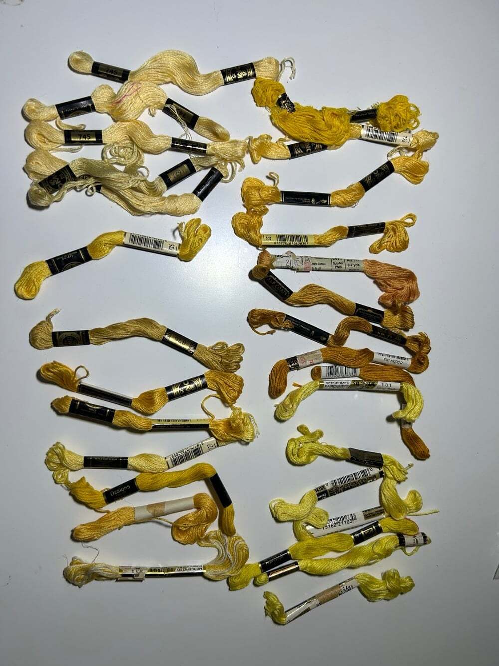 28 Skeins of yellow embroidery threads different shades and brands